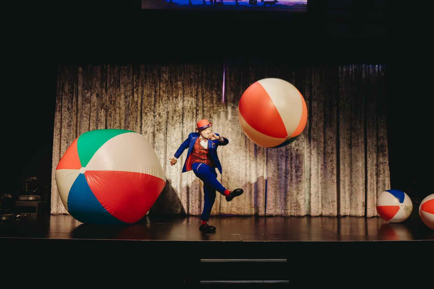 Chasing the giant beach balls across the stage