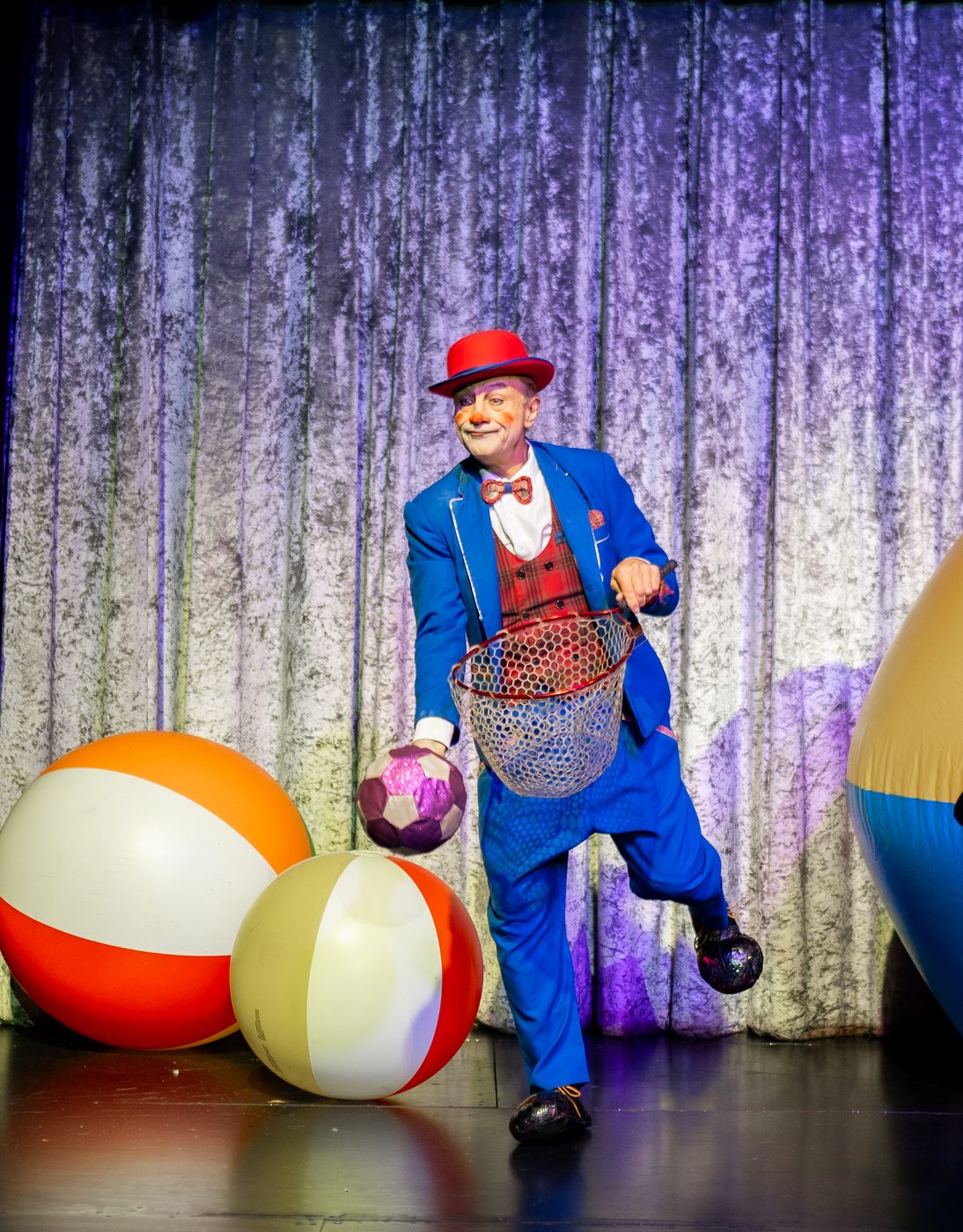 Three giant beach balls on stage